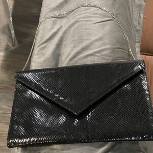NWOT Designer leather Elegant Black Clutch Bag w/metal snap w/hanging chain